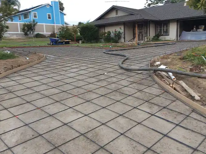 Driveway area formed and gridded with rebar after the old concrete was removed