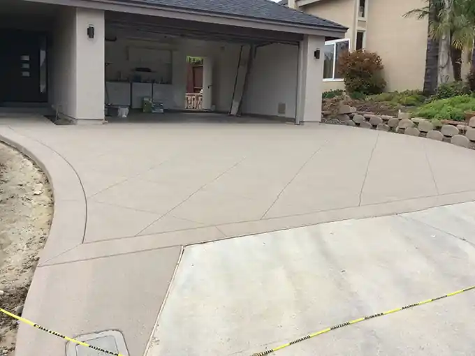Smooth new concrete slab at an open garage door